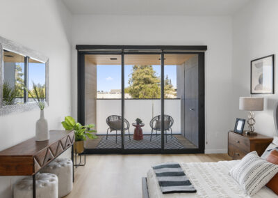 Bedroom Room with Private Balcony of a Staged Home at 2515 El Camino Real, Palo Alto, California